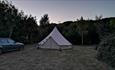 Isle of Wight, Camp Wight, Accommodation, Dusk image of Bell Tent on large woodland plot
