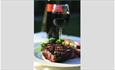 Steak and bottle of wine at Vernon Cottage, Shanklin, local produce