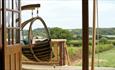 View of porch with hammock with views of countryside from safari tent, Glamping the Wight Way, self catering, Isle of Wight