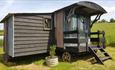 Outside view of Ellie Shepherds Hut at Windmill Campersite, Isle of Wight, Glamping