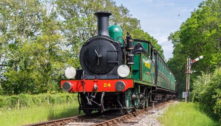 Steam train on tracks surrounded by countryside, Isle of Wight Steam Railway, Things to Do, Isle of Wight