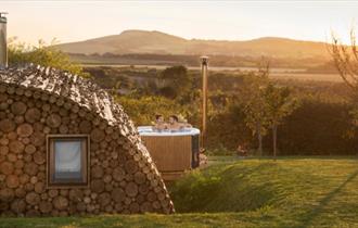 Outside view of Modulog with hot tub at Tapnell Farm, Isle of Wight, glamping, self catering