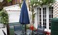 Outside dining area on patio at West View Holiday Cottage, Ryde, Self-catering