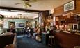 Inside seating and bar at The Cedars, Wootton, pub