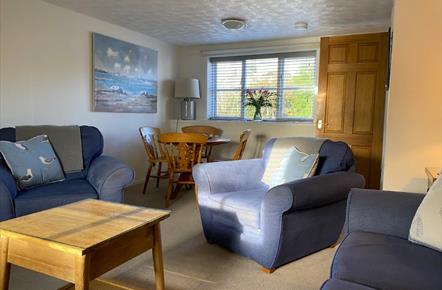 Lounge area with table and chairs by window