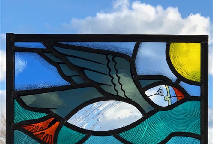 leaded glass panel of flying puffin