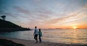 Walking on the beach at sunset