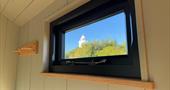 View of lighthouse through window