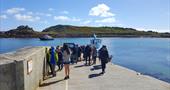 People waiting for tripper boat on quay