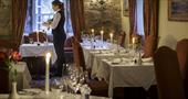 The Star Castle Hotel's candlelit restaurant, with a waitress