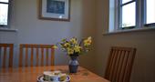 Dining table, flowers and afternoon tea