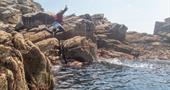 Kernow Coasteering jumping of smaller rocks
