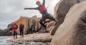 Kernow Coasteering rock wall run and jump