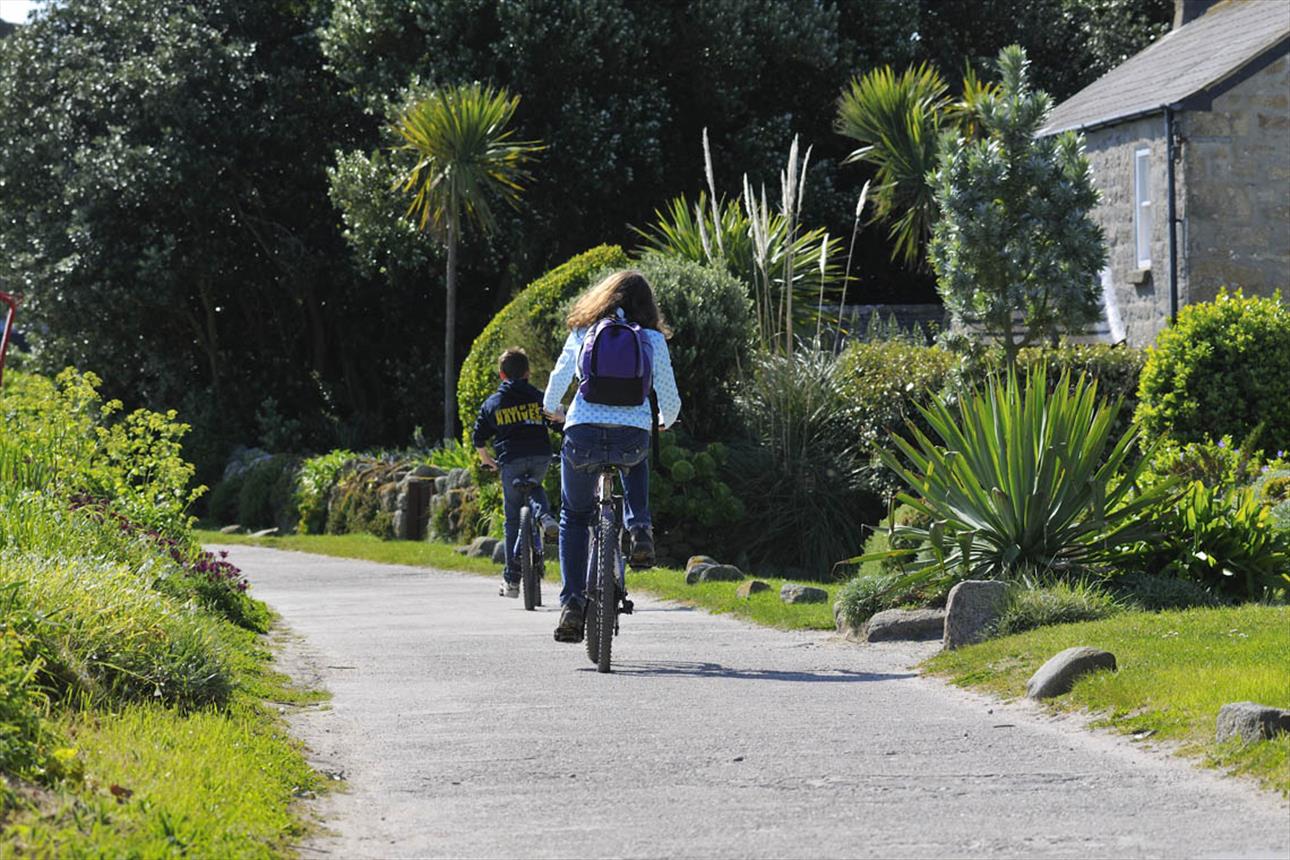 Mother and child cycling around the lanes on Tresco