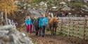 Guides and horses ready for a hike.