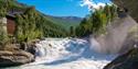 Person going over the Prestfossen zipline - Aktiv i Lom