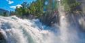 Person going over the Prestfossen zipline - Aktiv i Lom