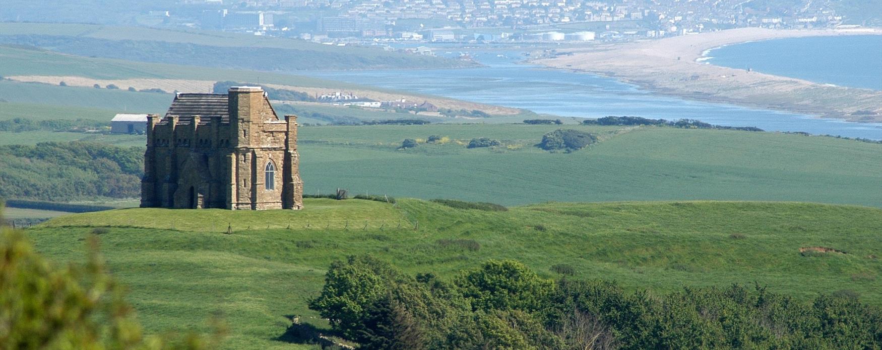 St Catherine's Chapel above Abbotsbury, with Chesil Beach beyond
