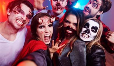 Group of people dressed in Halloween Costumes