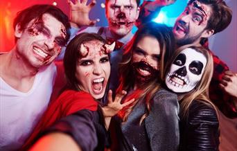 Group of people dressed in Halloween Costumes