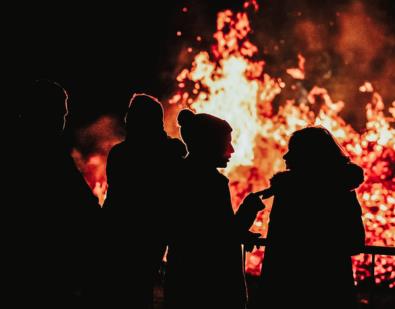 People in front of a bonfire at Gisburn Park.