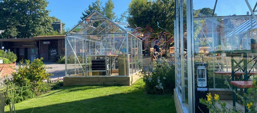 Green houses at Cartford Inn