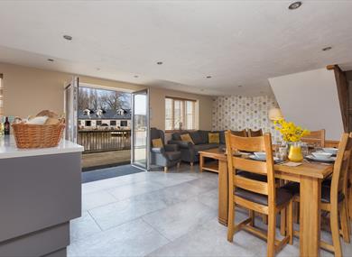 Open living space decorated in orange and white