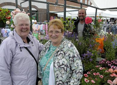 Shoppers at flower and plant stall