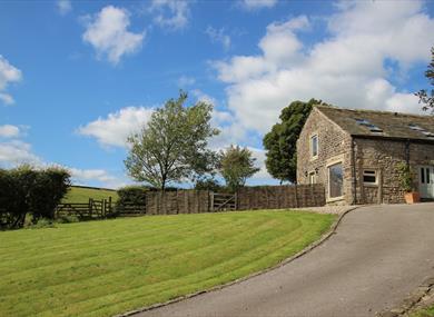 Image of outside the barn on a sunny day.