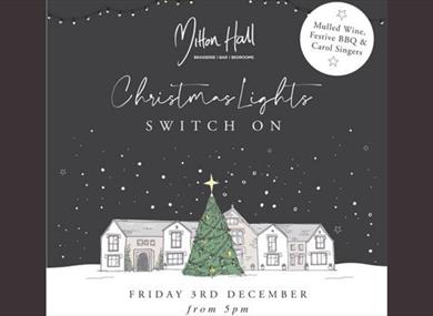 A festive drawing of Mitton Hall in the snow at night with a Christmas tree in the front of the building.