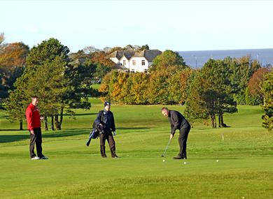 Playing golf at Morecambe Golf Course