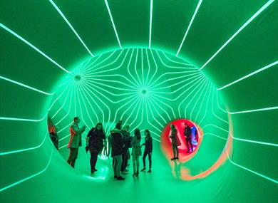 People inside the architects of air, surrounded by lights.
