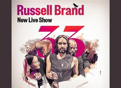 Promotional poster for the new live show.  Russell Brand stands holding a pen in one hand and a book in the other.  He is surrounded by people and the