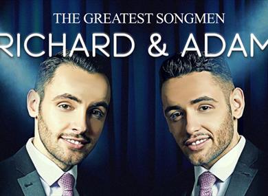 Promotional poster of the show, with the two performers smiling at the camera.