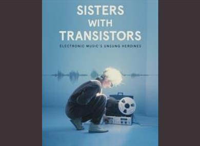 Promotional poster showing a lady crouching over electronic equipment.