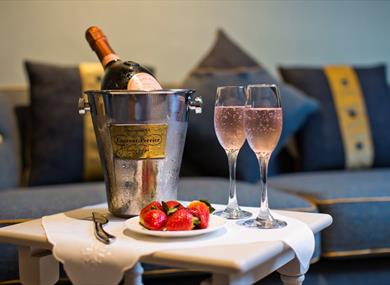 A table set up with champagne for two.