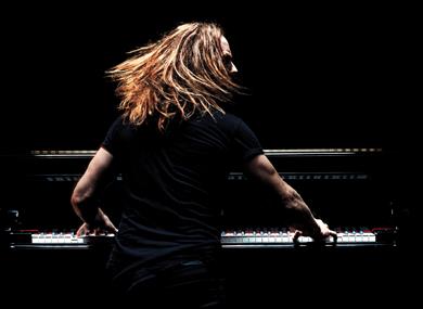 Tim Minchin on stage