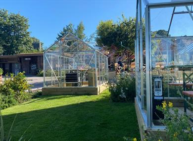 Green houses at Cartford Inn