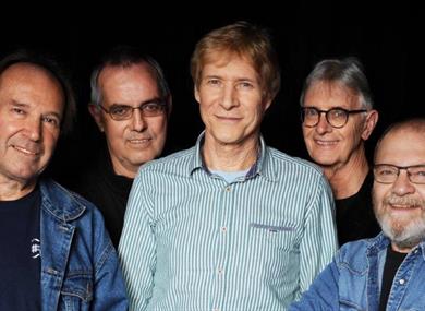 The five members of the group pose for a picture.