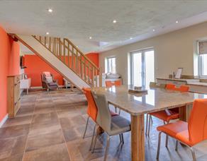 Open living space decorated in orange and white