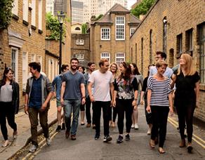 A dozen performers walk through the streets of Lancaster city.  Image credit Eliza Brown