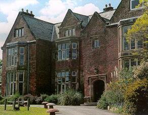 Outdoor picture of Heskin Hall, off its driveway.