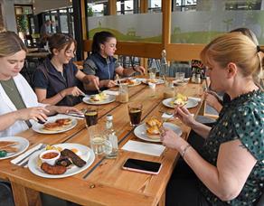 Ladies enjoy a coffee and a catch up in the cafe.