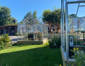 Green houses at Cartford Inn