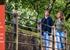 Couple walking on bridge - England Originals