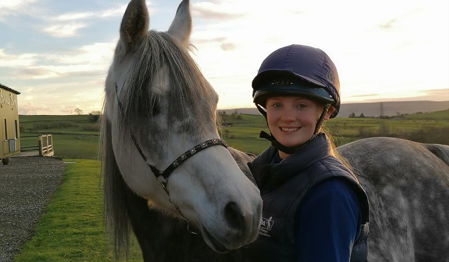 Care for a pony - young person with horse image