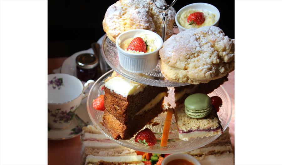 Afternoon tea table display with three tiers of treats.