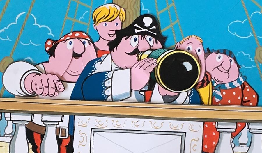 Cartoon of Captain Pugwash and his friends on a pirate ship.