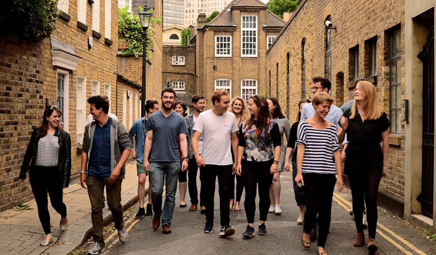 A dozen performers walk through the streets of Lancaster city.  Image credit Eliza Brown