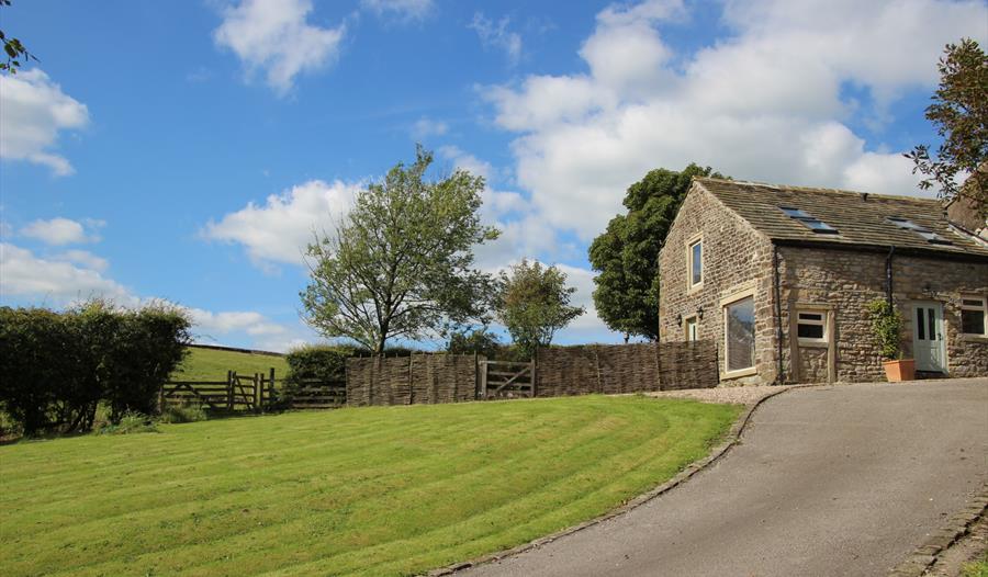 Image of outside the barn on a sunny day.